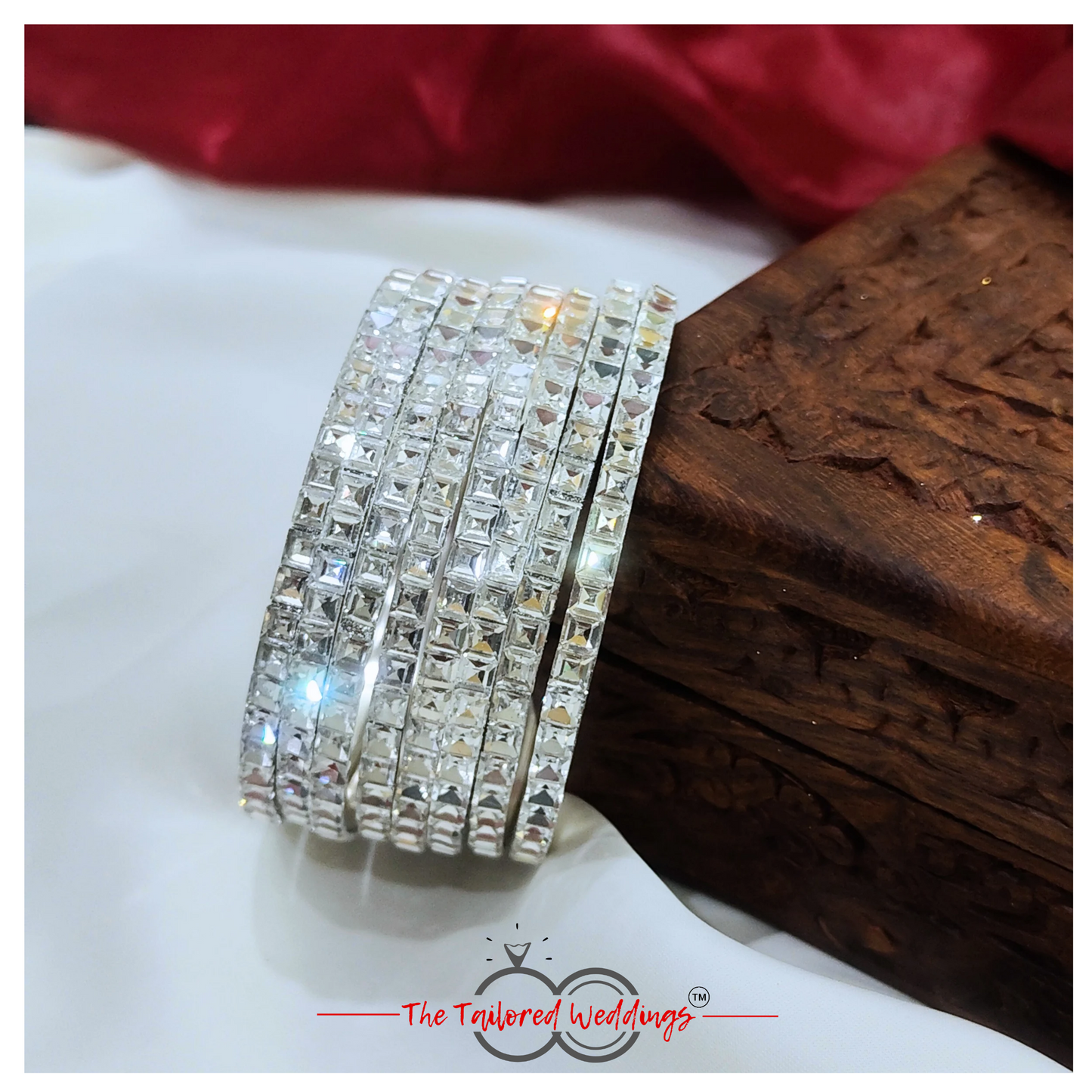 Traditional-style silver bangles with handcrafted lac detailing and shimmering stones
