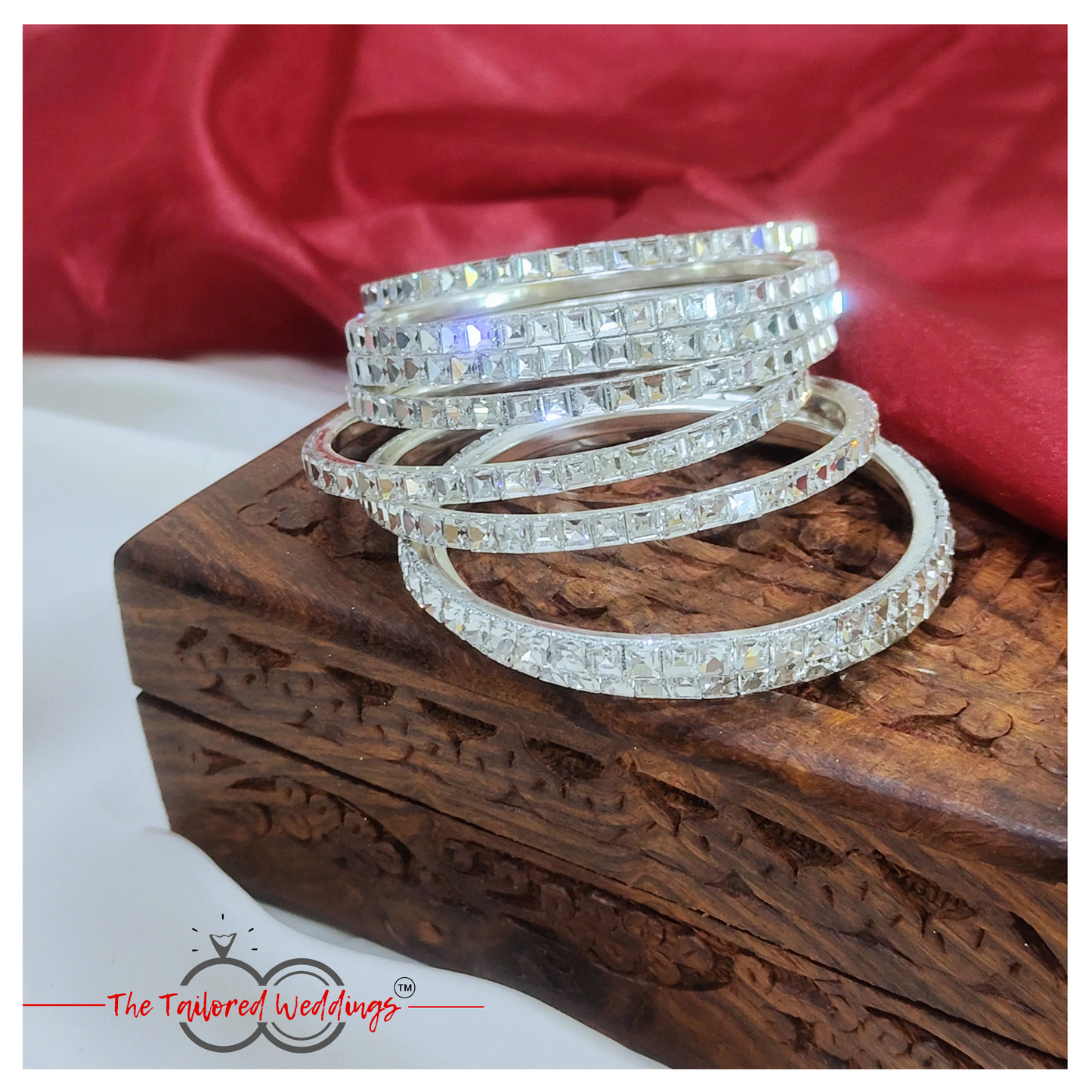 Traditional-style silver bangles with handcrafted lac detailing and shimmering stones