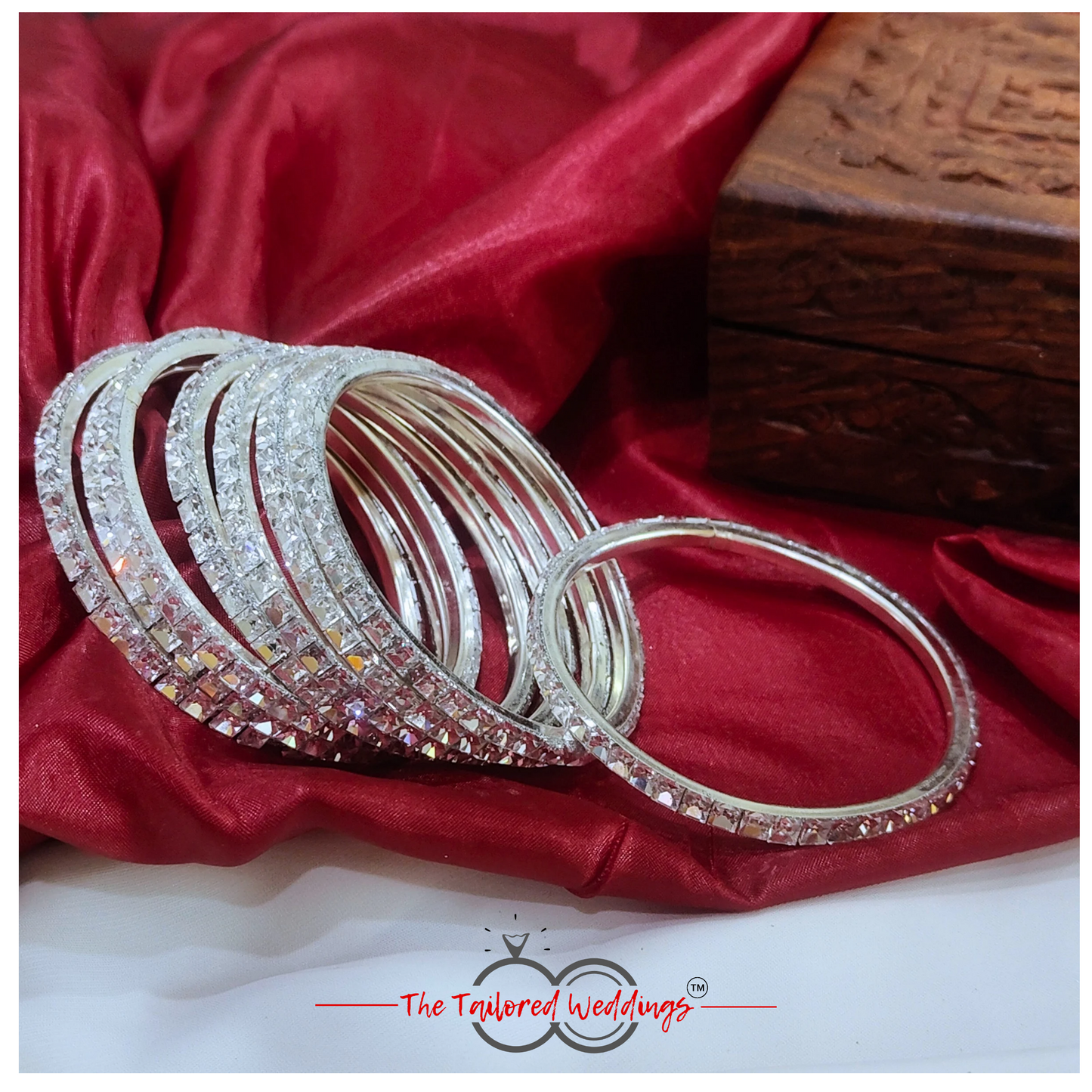 Traditional-style silver bangles with handcrafted lac detailing and shimmering stones