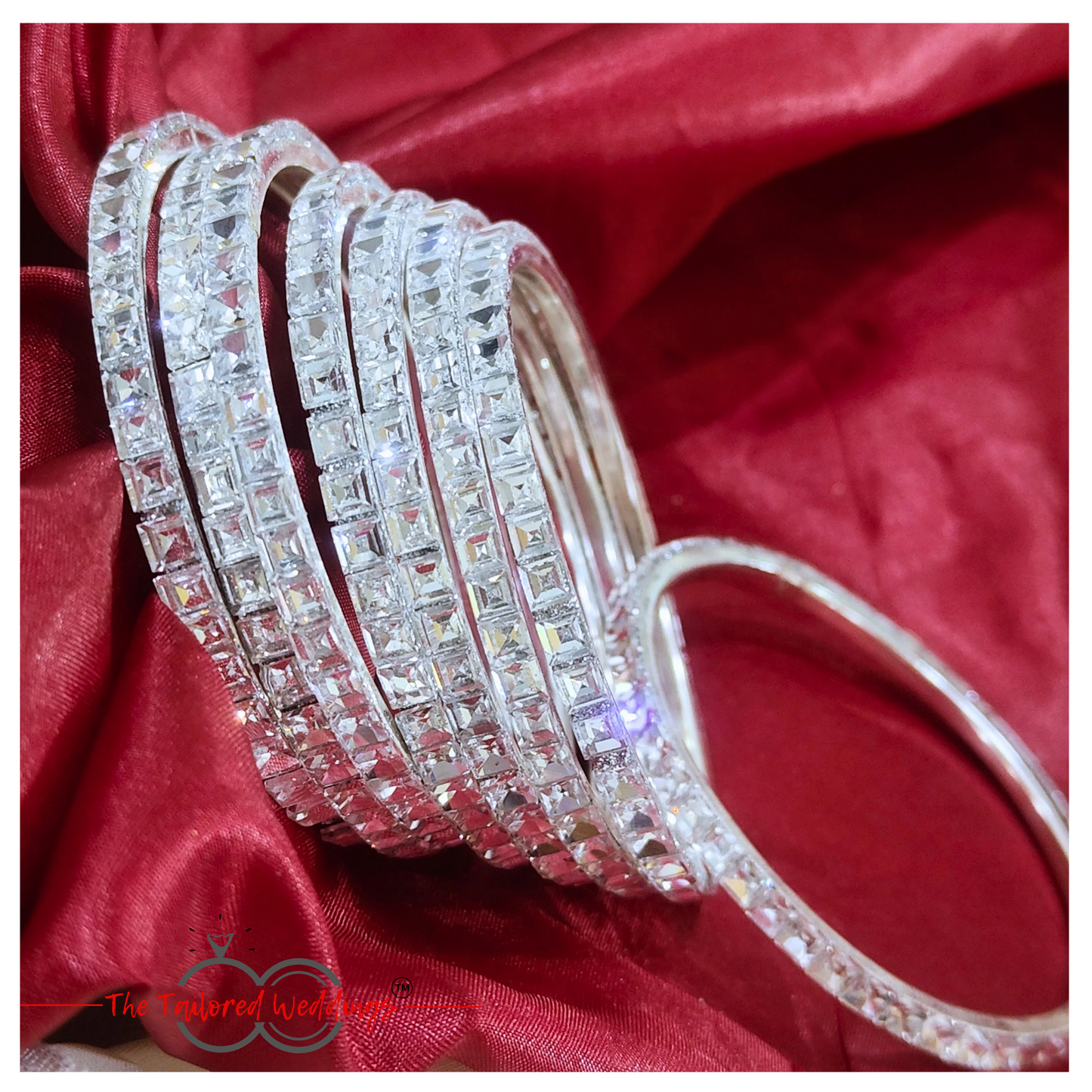 Traditional-style silver bangles with handcrafted lac detailing and shimmering stones