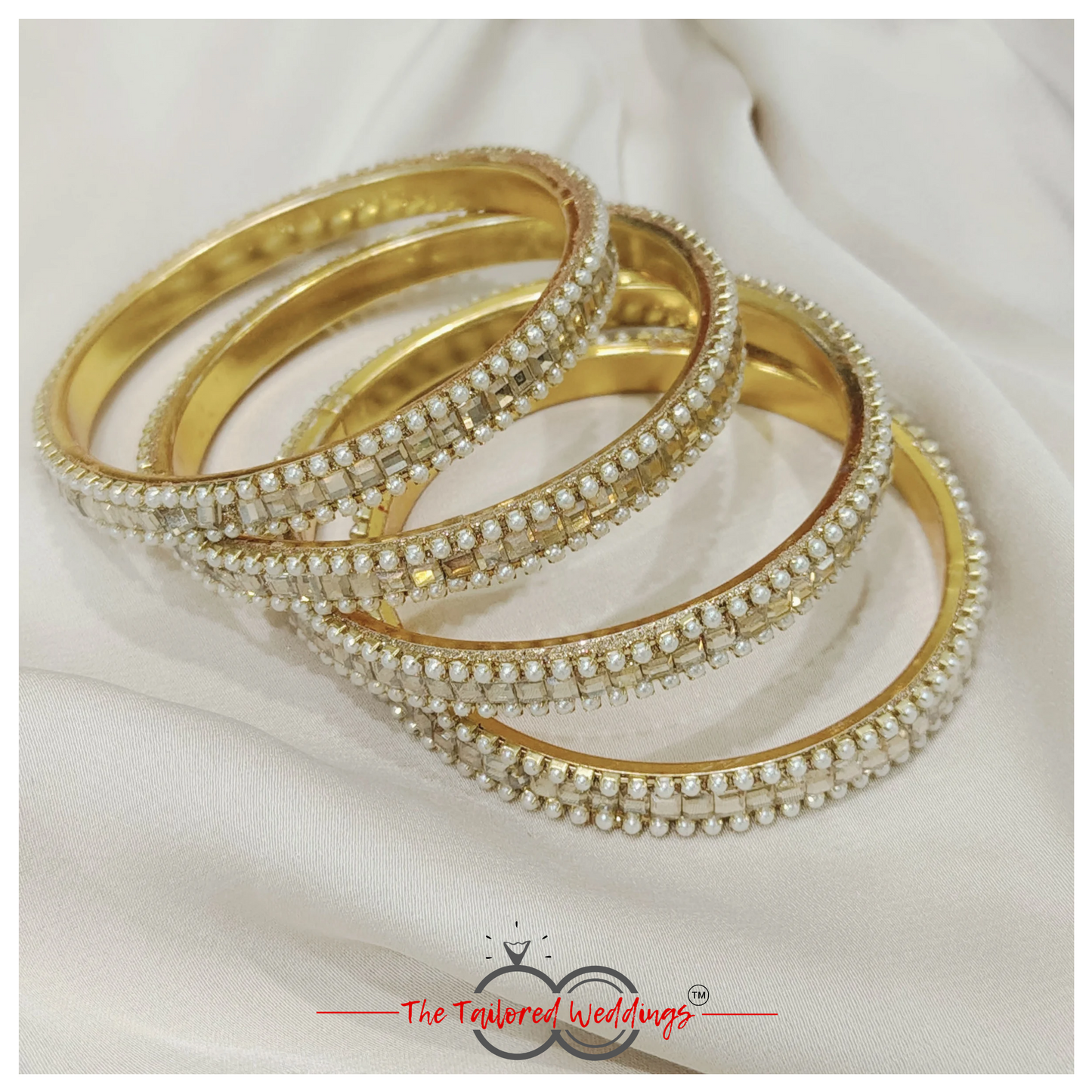 Traditional Indian lac and metal bangle studded with delicate moti and glimmering shadow stones.