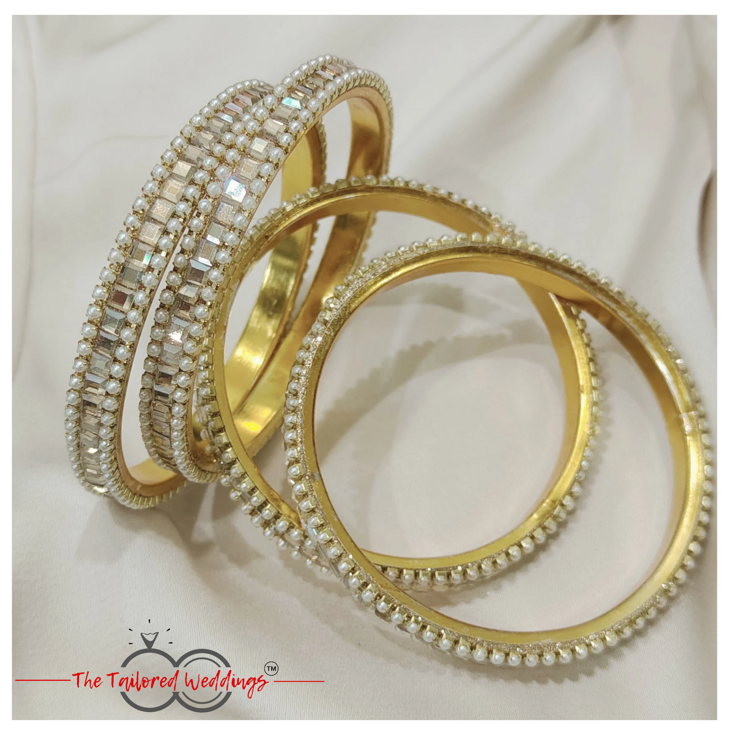 Traditional Indian lac and metal bangle studded with delicate moti and glimmering shadow stones