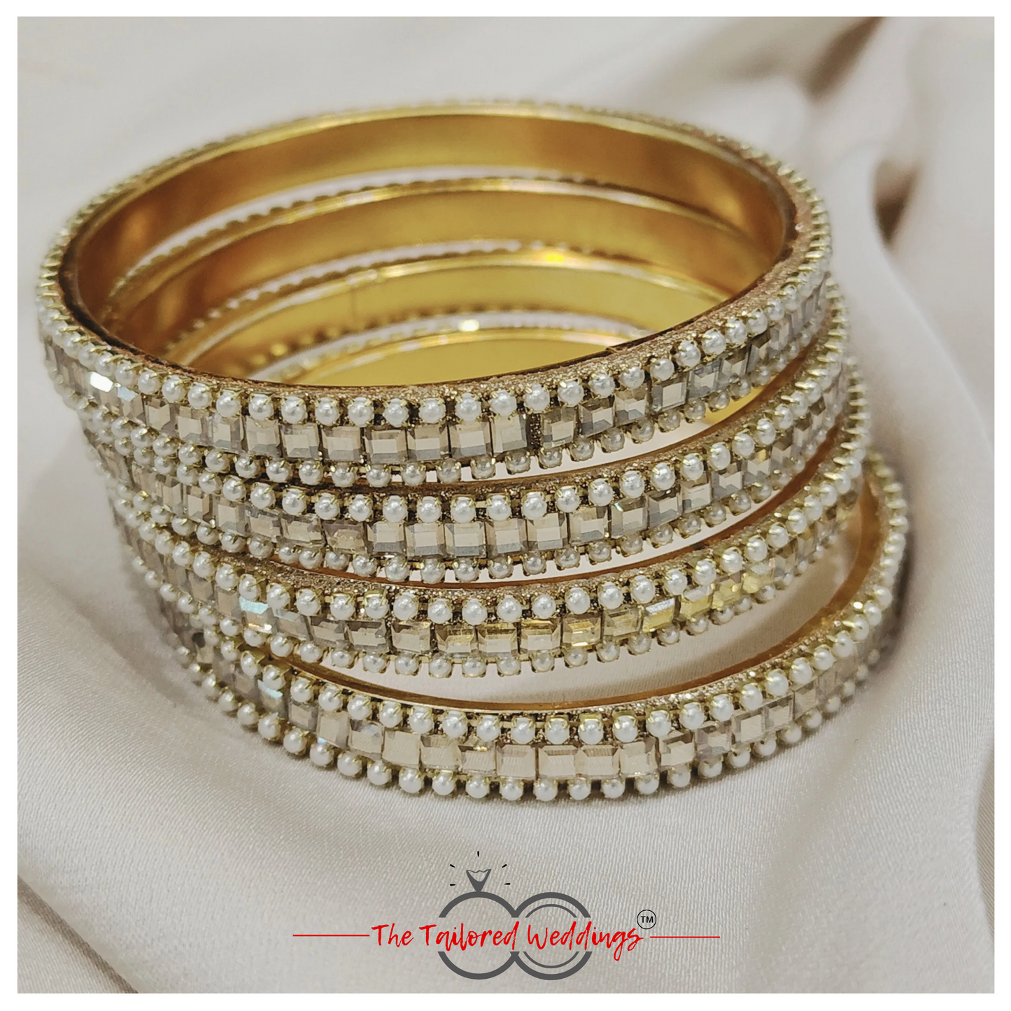 Traditional Indian lac and metal bangle studded with delicate moti and glimmering shadow stones