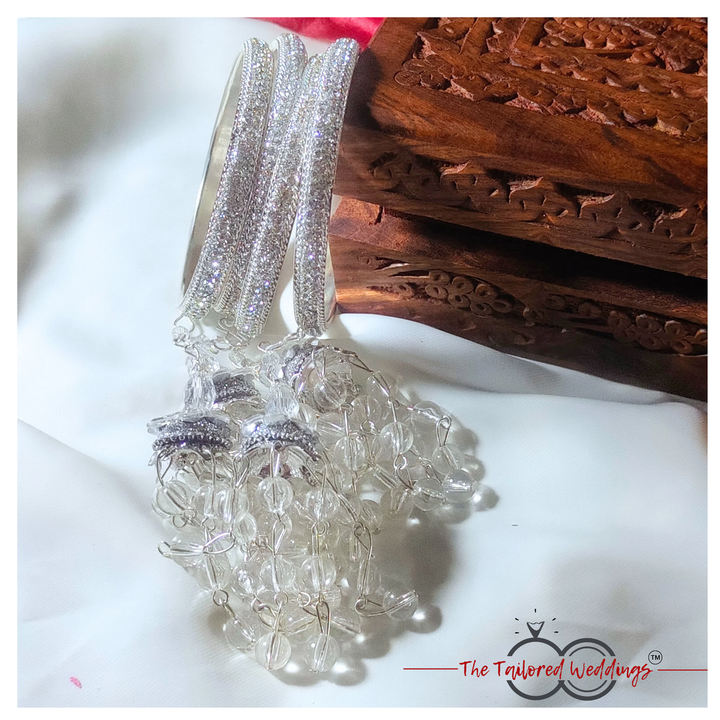 Silver lac and metal latkan bangles adorned with small studded stones and handcrafted detailing