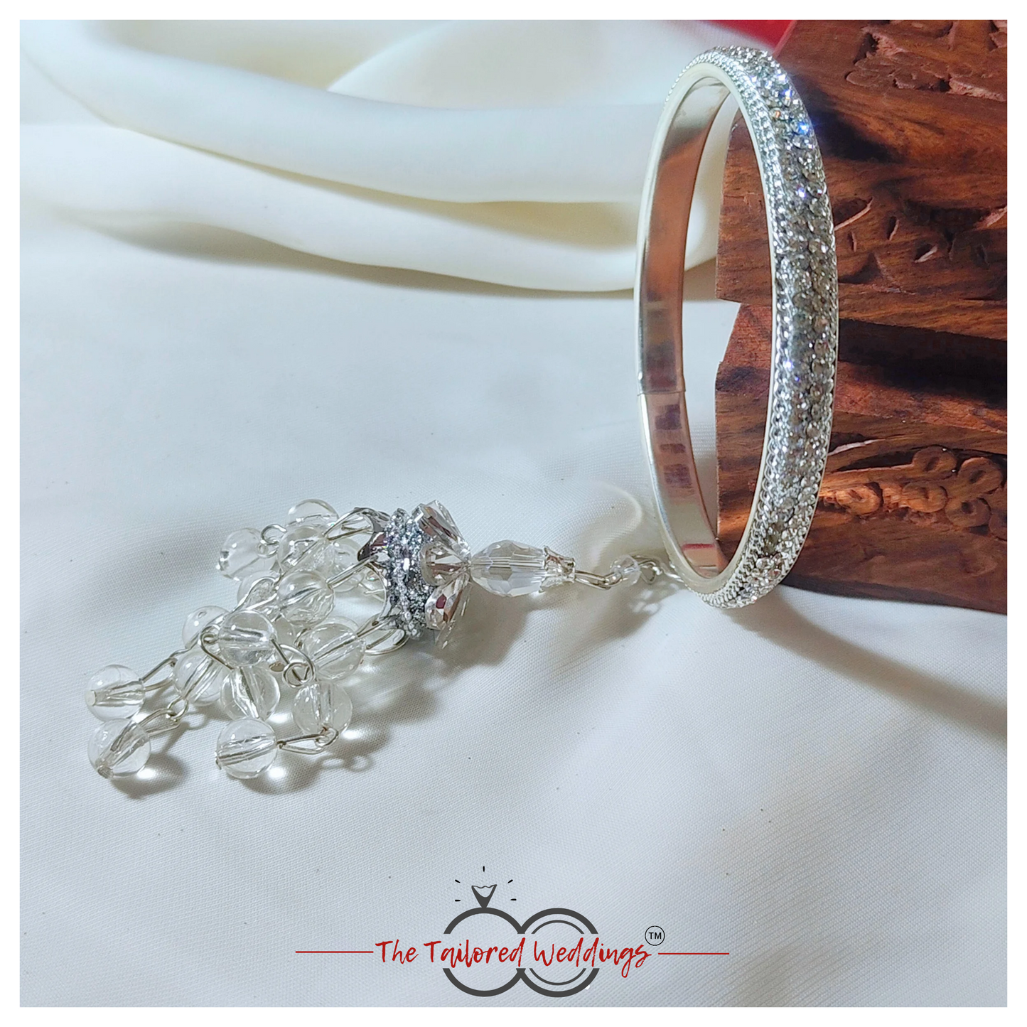 Silver lac and metal latkan bangles adorned with small studded stones and handcrafted detailing