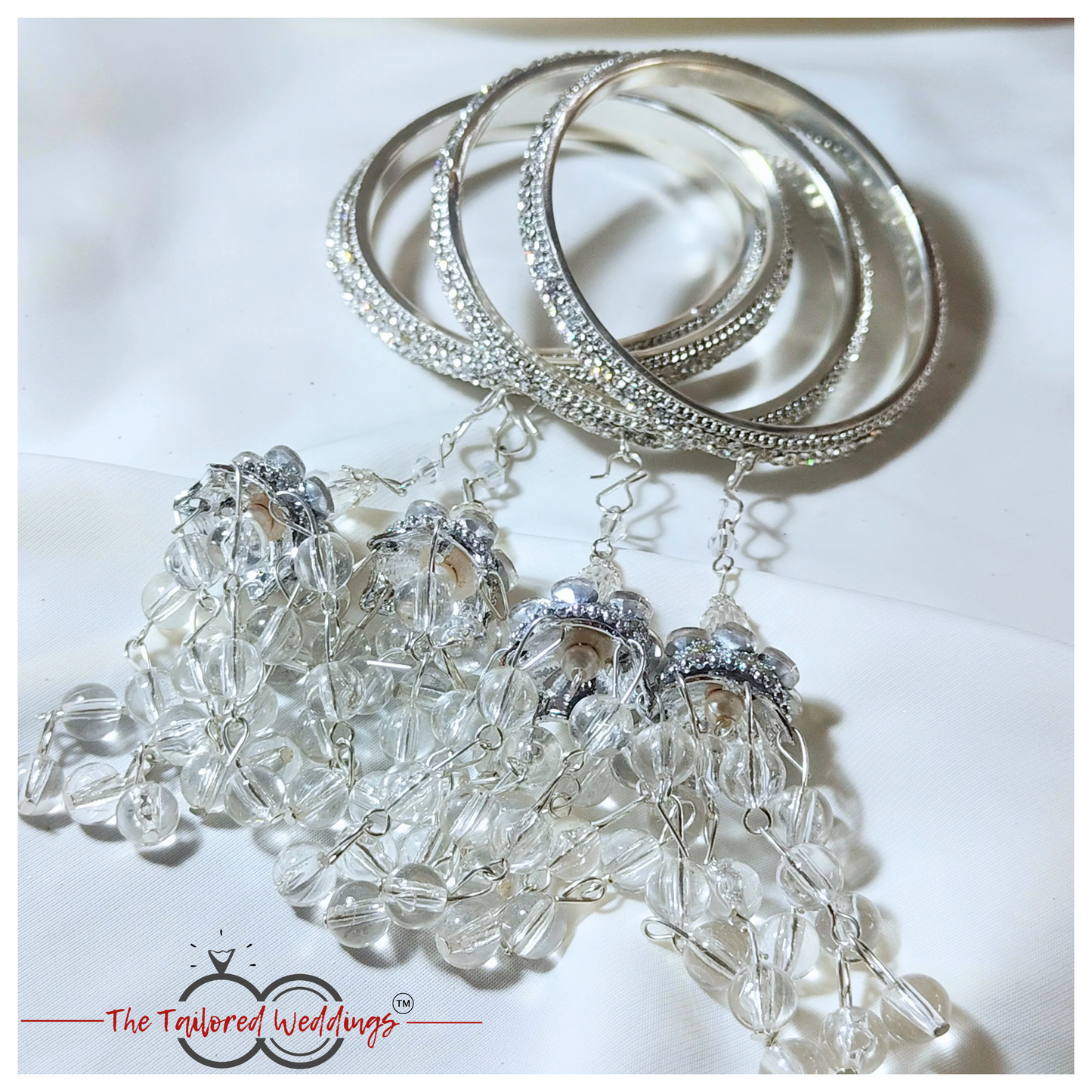 Silver lac and metal latkan bangles adorned with small studded stones and handcrafted detailing