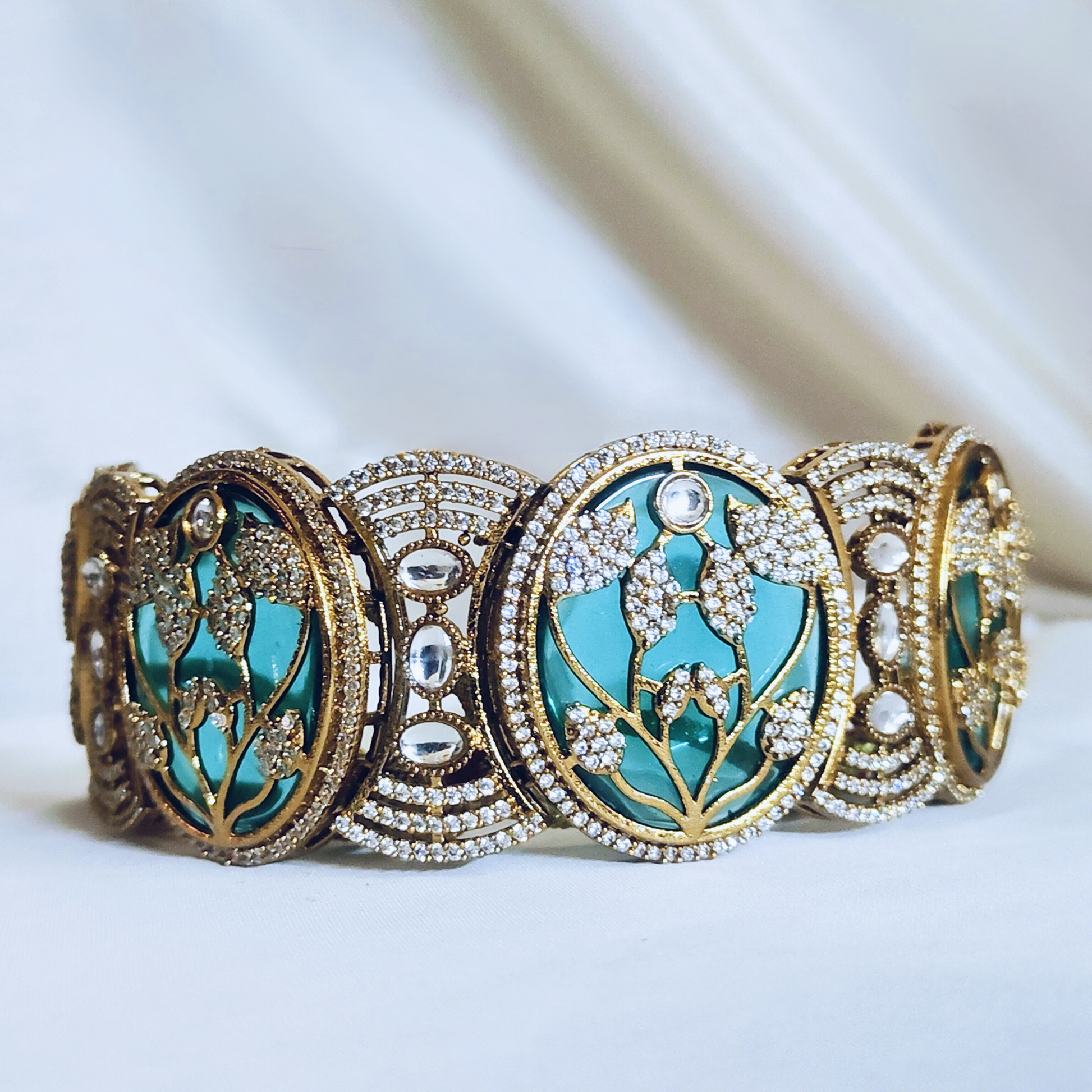 Stone-studded choker necklace set featuring leaf patterns – perfect for weddings and festive occasions.