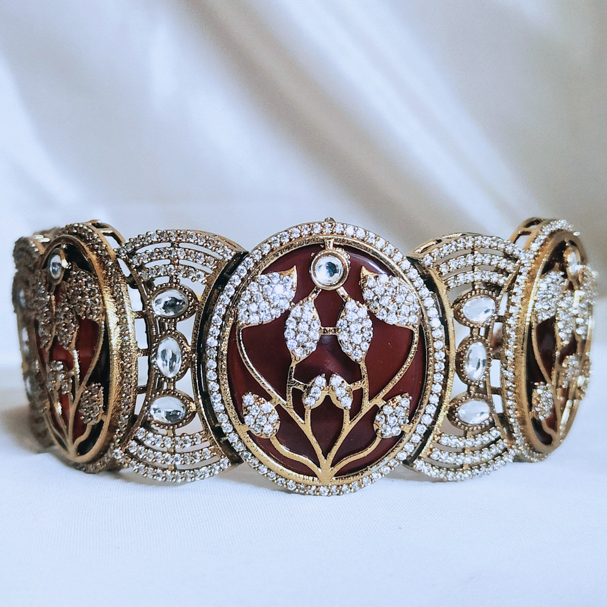 Stone-studded choker necklace set featuring leaf patterns – perfect for weddings and festive occasions.